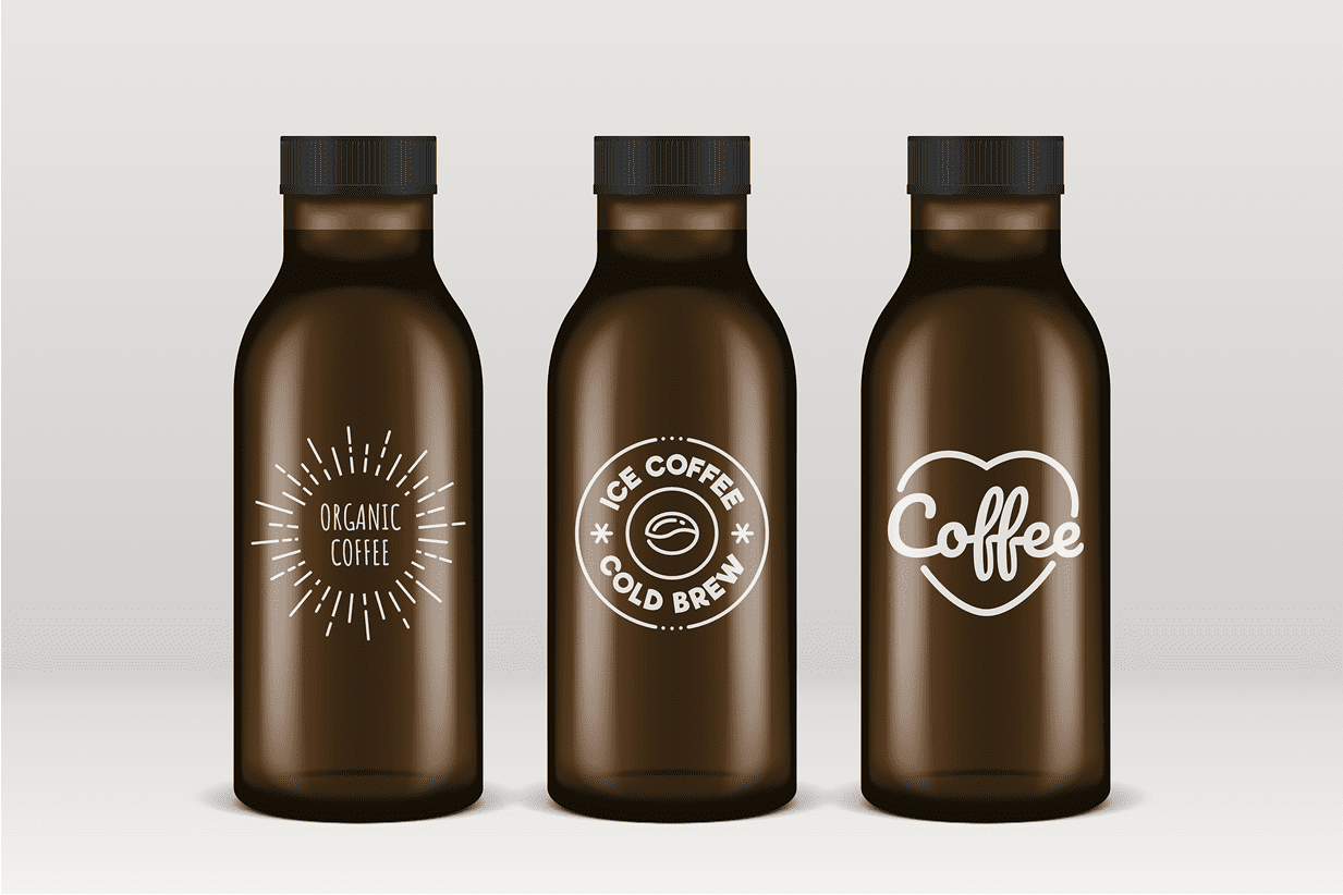Three brown bottles with coffee labels.
