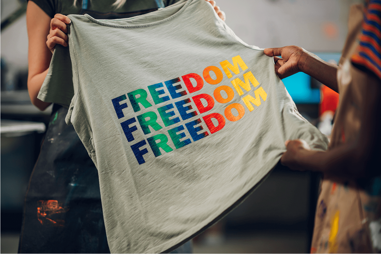T-shirt with colorful "FREEDOM" text design.